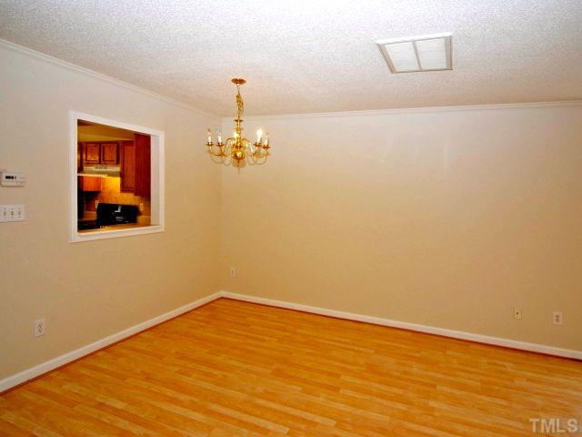 5952 Shady Grove Circle Raleigh, NC 27609 - Photo 12 of 25 a view of empty room with wooden floor