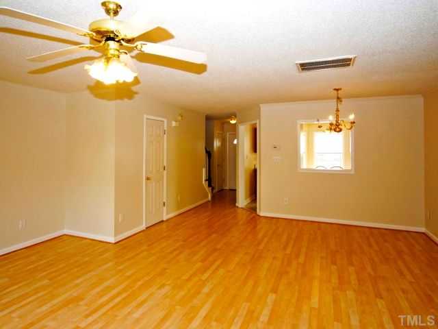 5952 Shady Grove Circle Raleigh, NC 27609 - Photo 15 of 25 a view of a room with a window and a ceiling fan