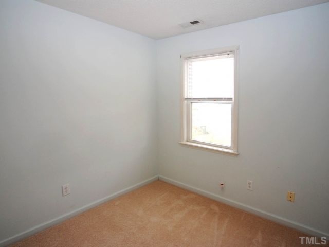 5952 Shady Grove Circle Raleigh, NC 27609 - Photo 18 of 25 an empty room with a window