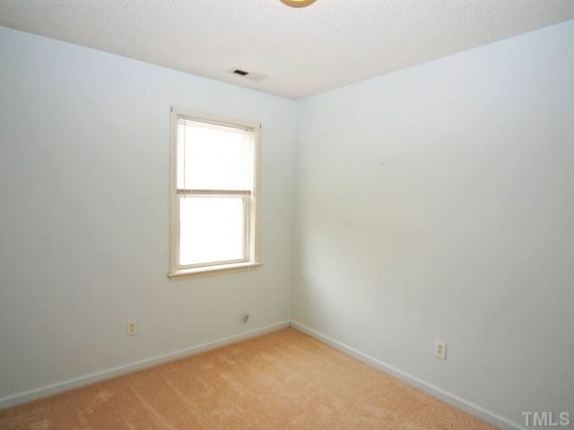 5952 Shady Grove Circle Raleigh, NC 27609 - Photo 20 of 25 an empty room with a window