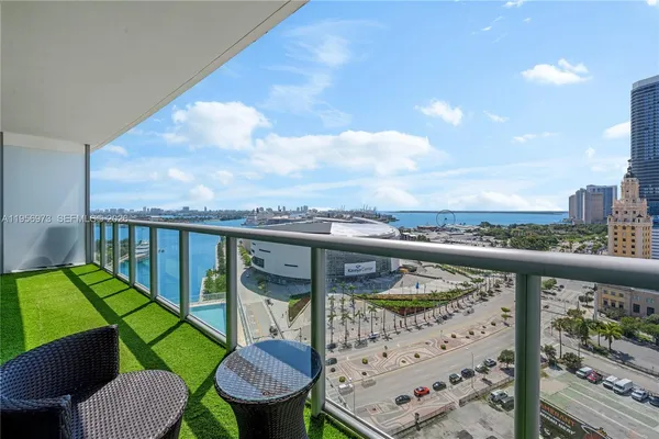 a view of a balcony with furniture