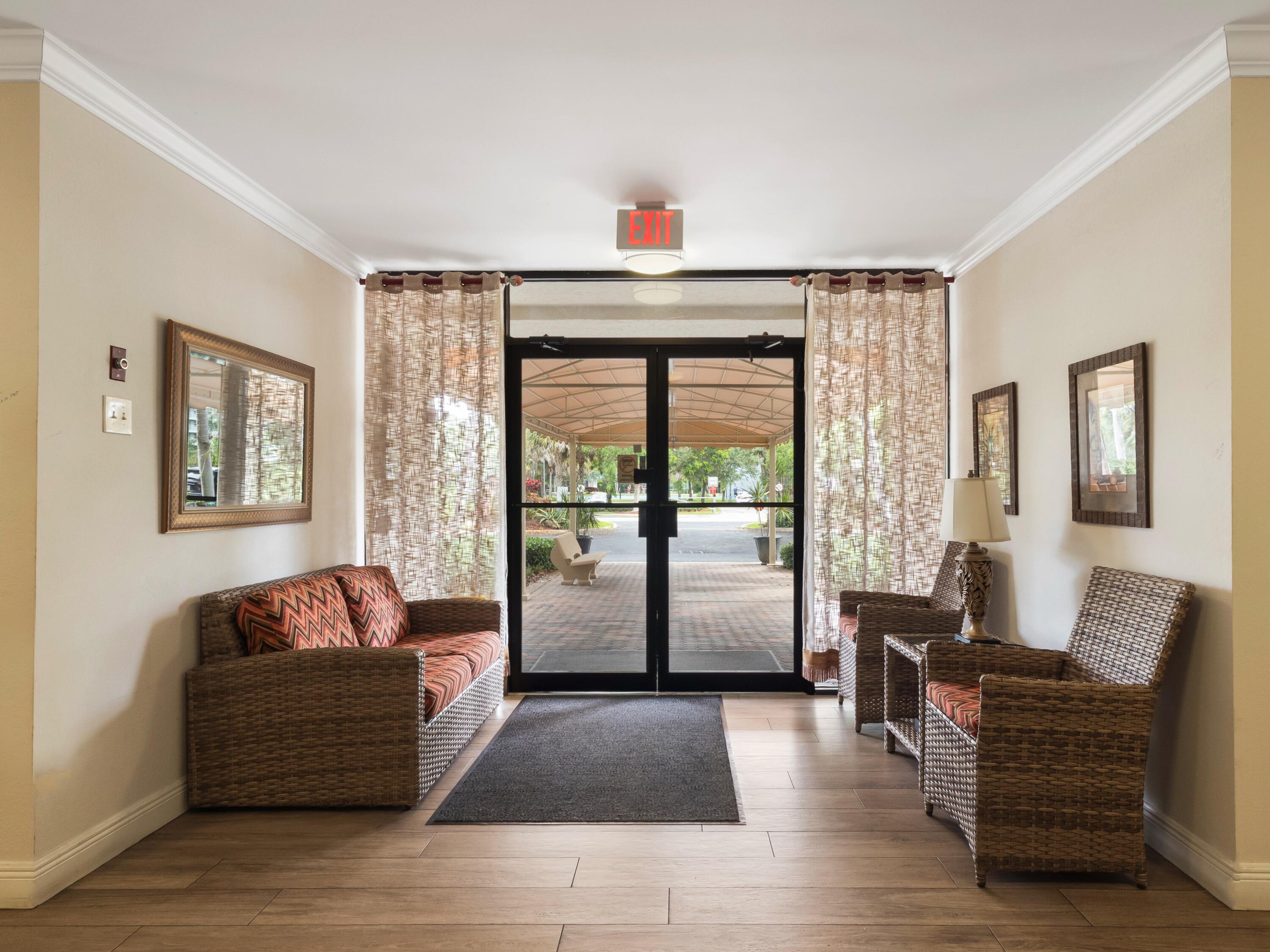 4030 West Palm Aire Drive, Unit 506 Pompano Beach, FL 33069 - Photo 3 of 15 Lobby Entrance