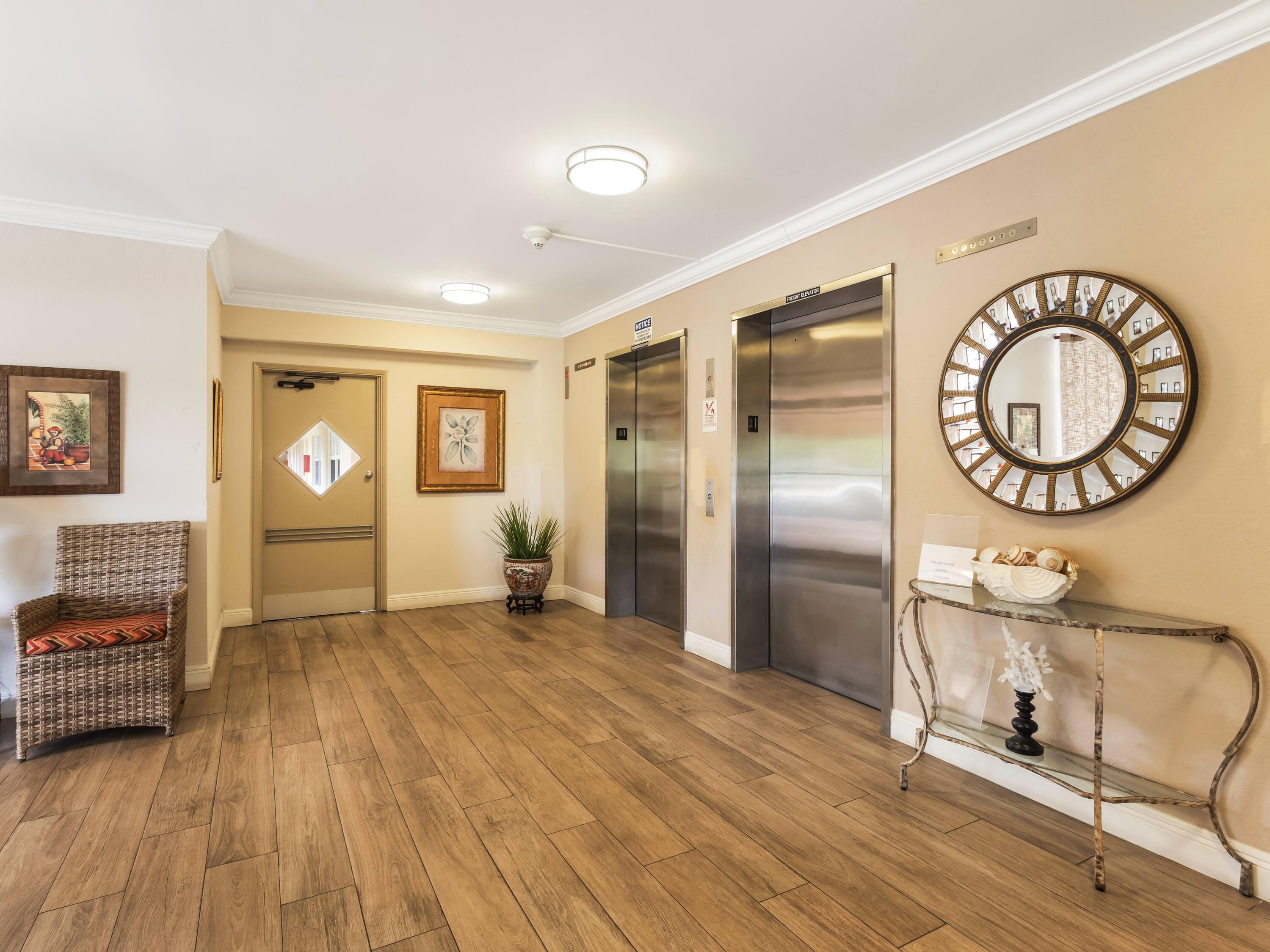 4030 West Palm Aire Drive, Unit 506 Pompano Beach, FL 33069 - Photo 4 of 15 Looby Elevators