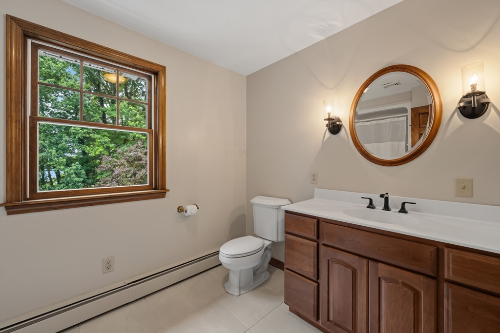 14 Demond Pond Row Rutland, MA 01543 - Photo 27 of 42 a bathroom with a toilet a sink and mirror