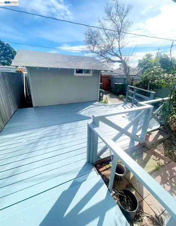 a view of a backyard from a balcony