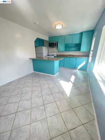 a view of a kitchen with kitchen