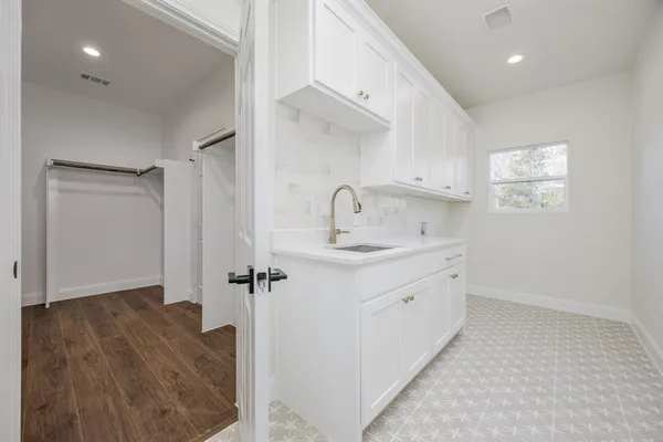a bathroom with a sink a mirror and shower