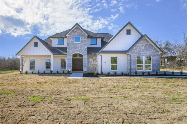 a front view of a house with yard