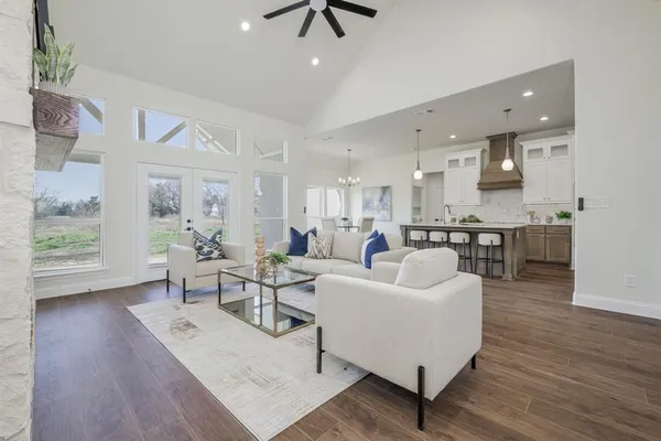 a living room with furniture or kitchen and a wooden floor
