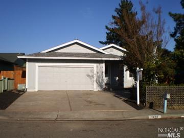 a front view of a house with a garage