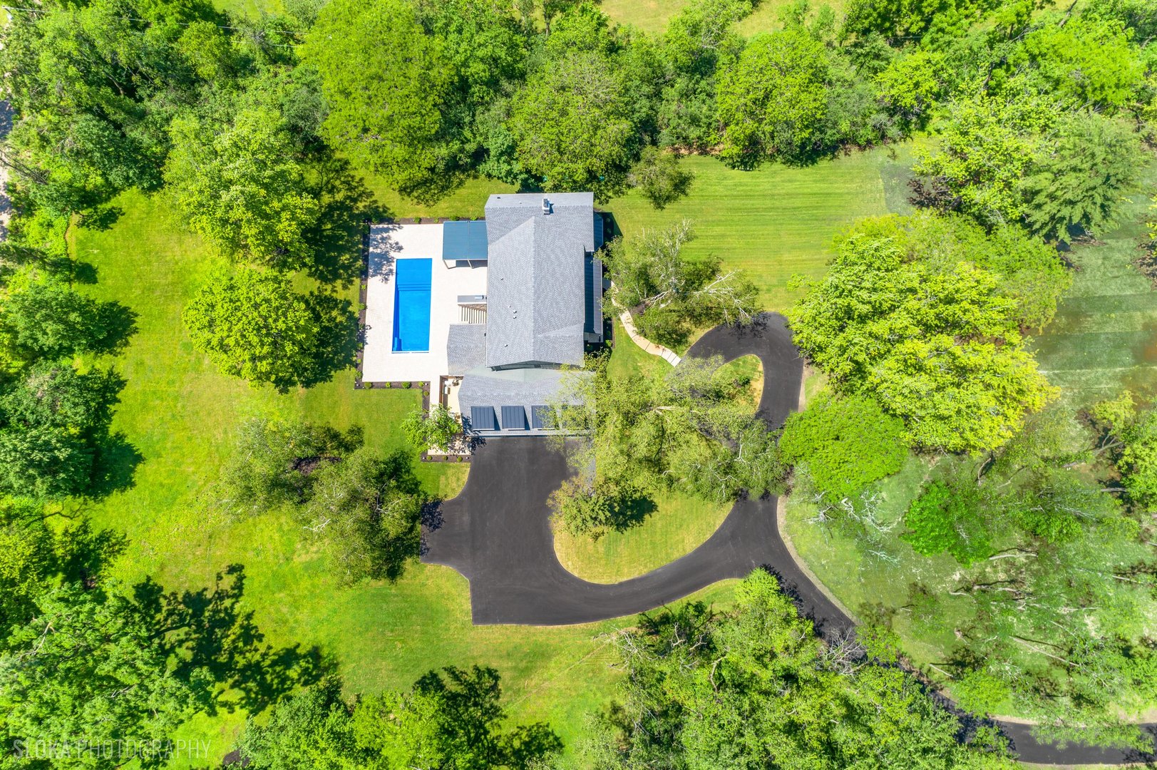 699 Plum Tree Road Barrington Hills, IL 60010 - Photo 6 of 84 an aerial view of a house