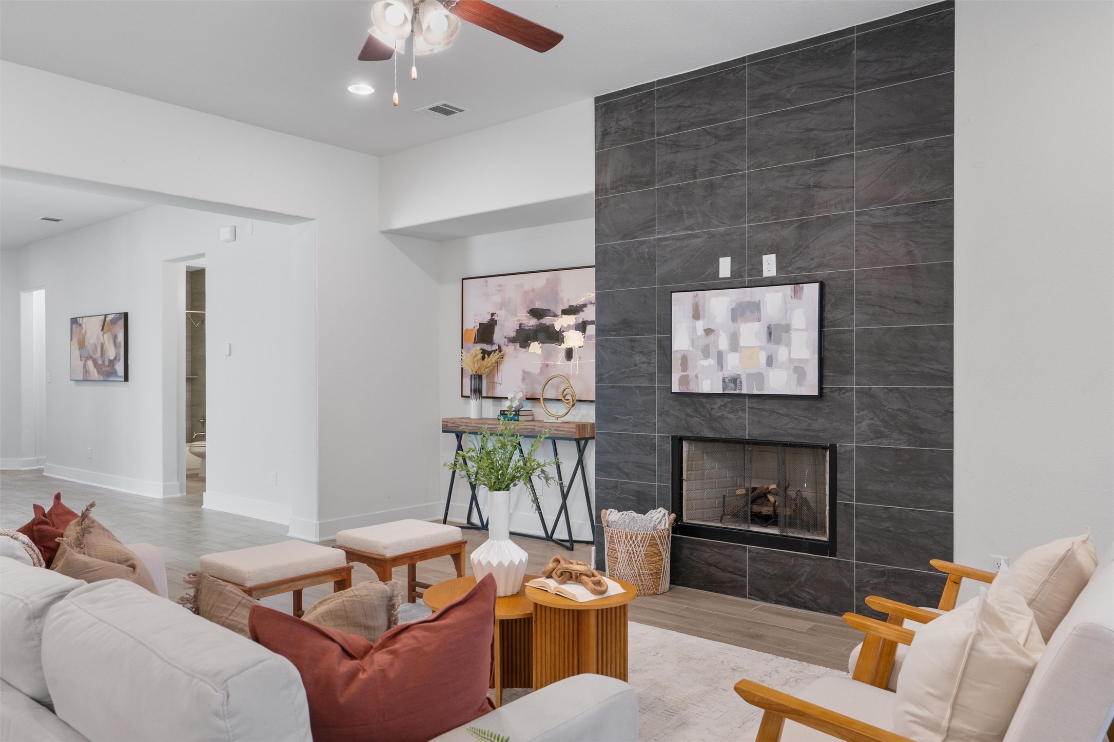 109 Wake Lane Georgetown, TX 78633 - Photo 12 of 34 a living room with furniture a flat screen tv and a fireplace
