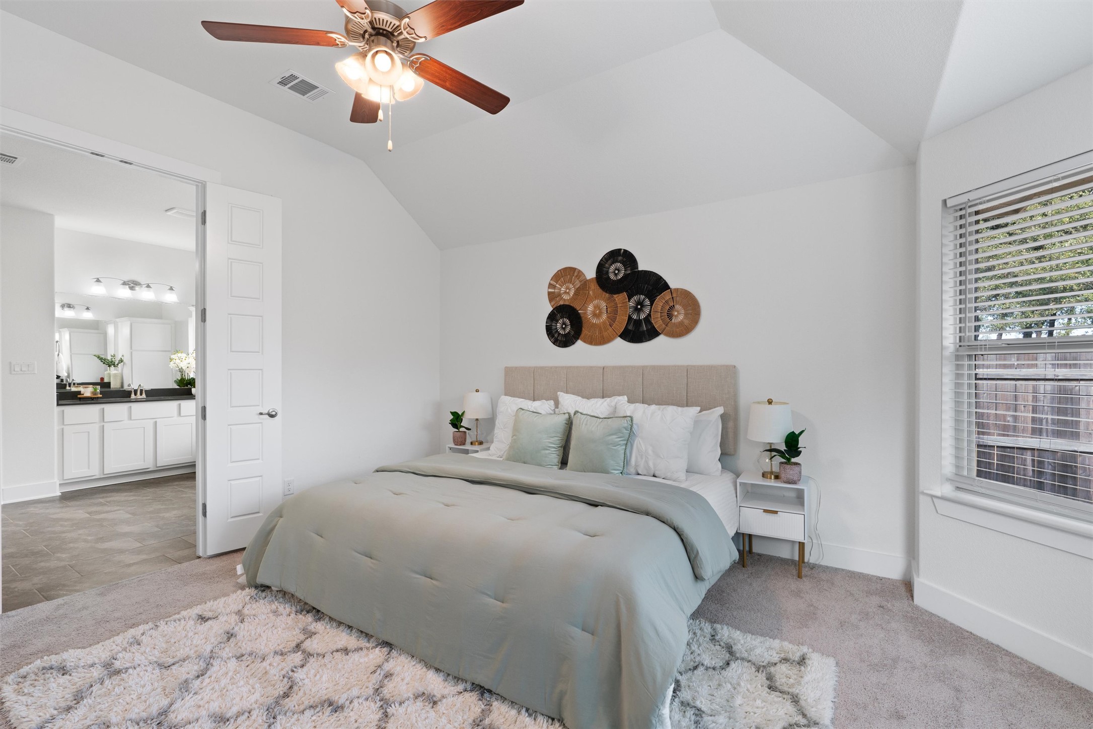 109 Wake Lane Georgetown, TX 78633 - Photo 16 of 34 a bedroom with a bed and a chandelier