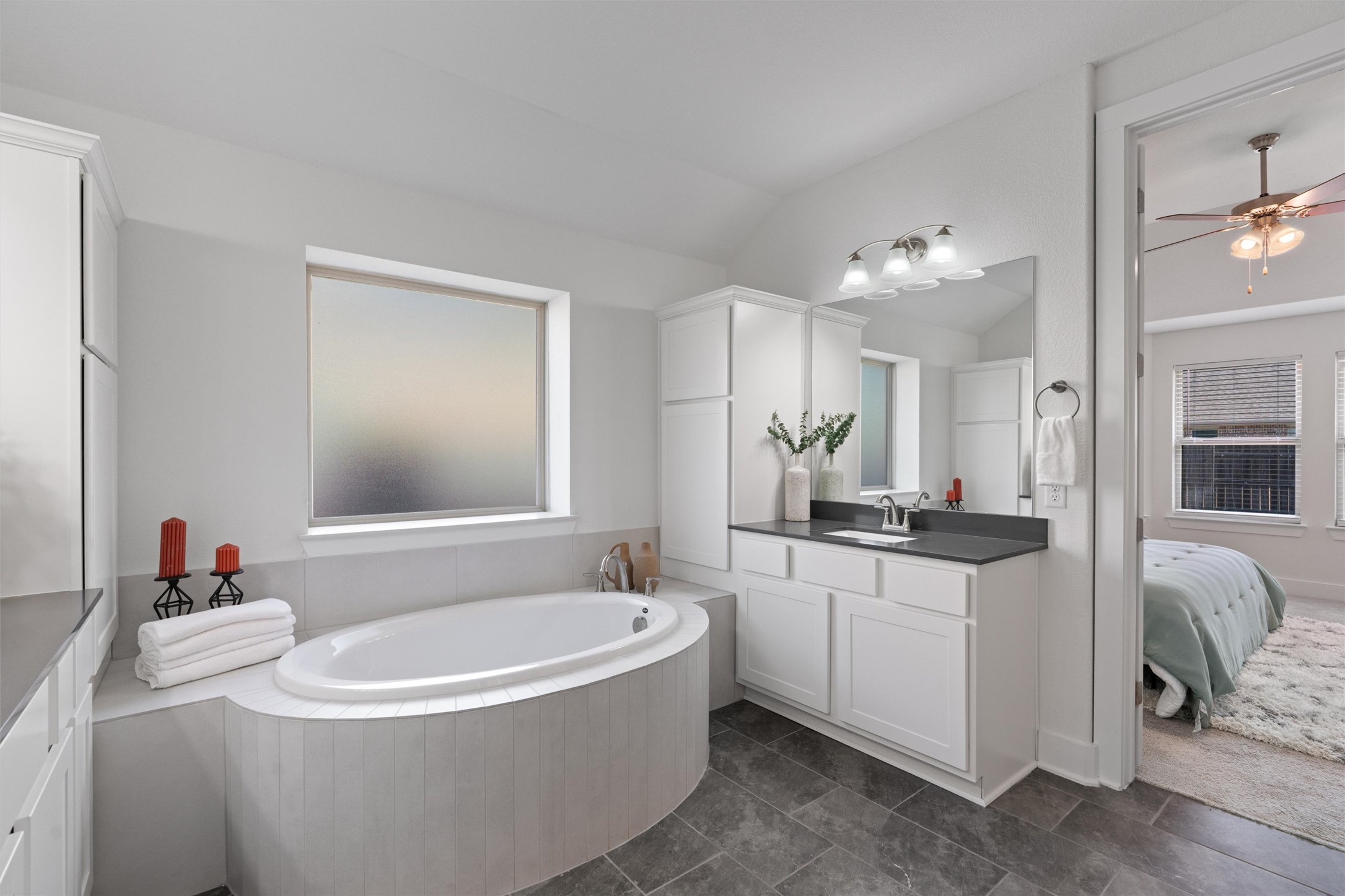 109 Wake Lane Georgetown, TX 78633 - Photo 18 of 34 a bathroom with a tub sink and mirror