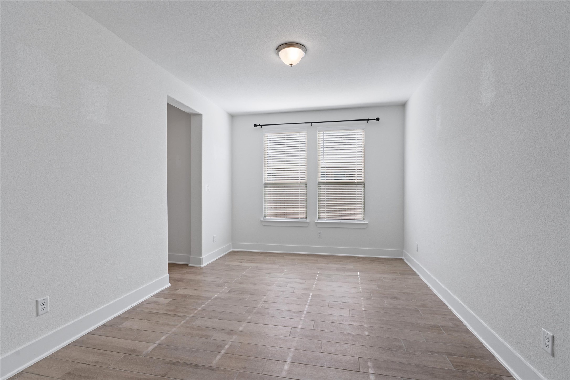 109 Wake Lane Georgetown, TX 78633 - Photo 20 of 34 wooden floor in an empty room with a window