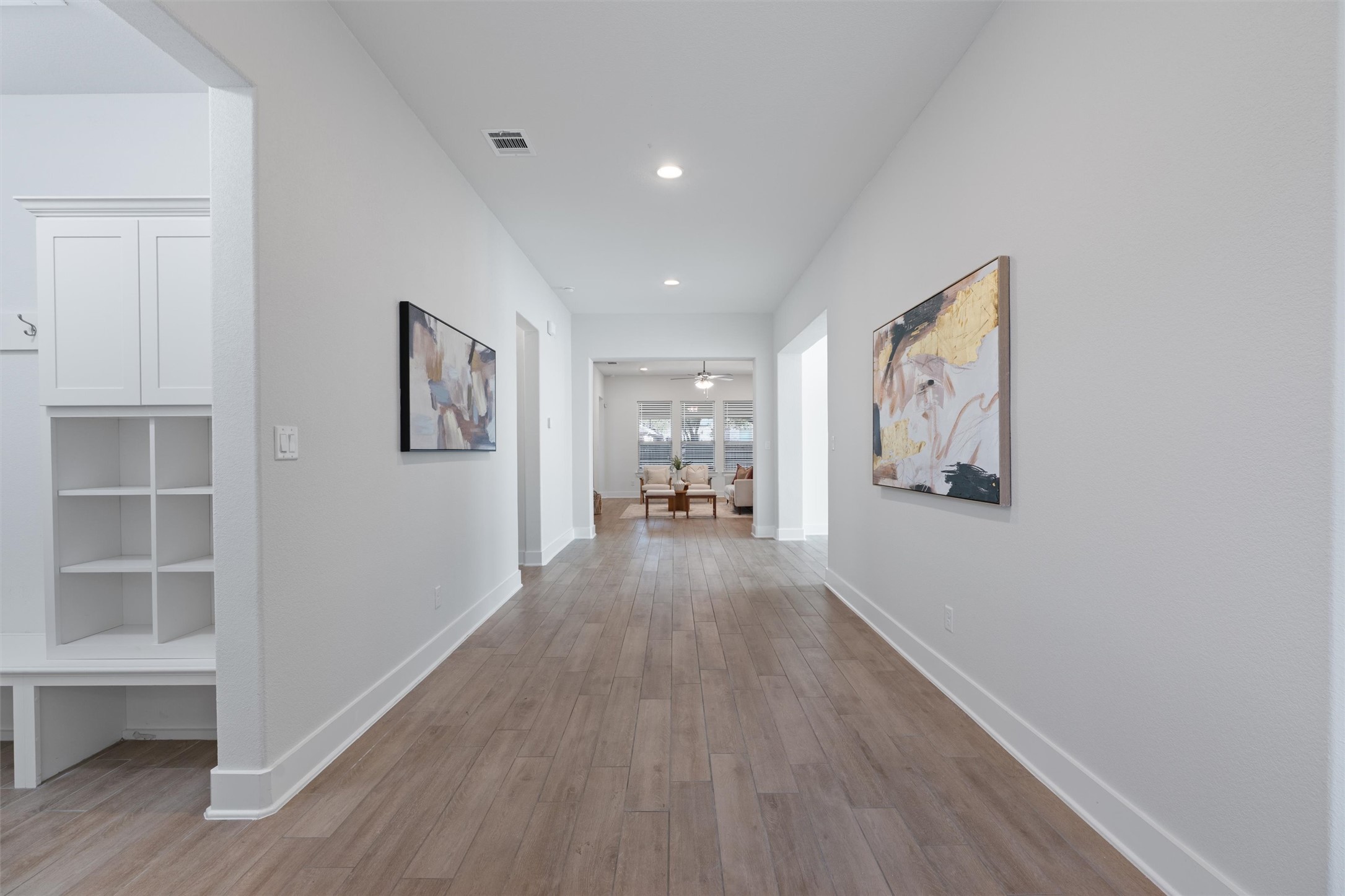 109 Wake Lane Georgetown, TX 78633 - Photo 27 of 34 a view of a hallway with wooden floor and furniture