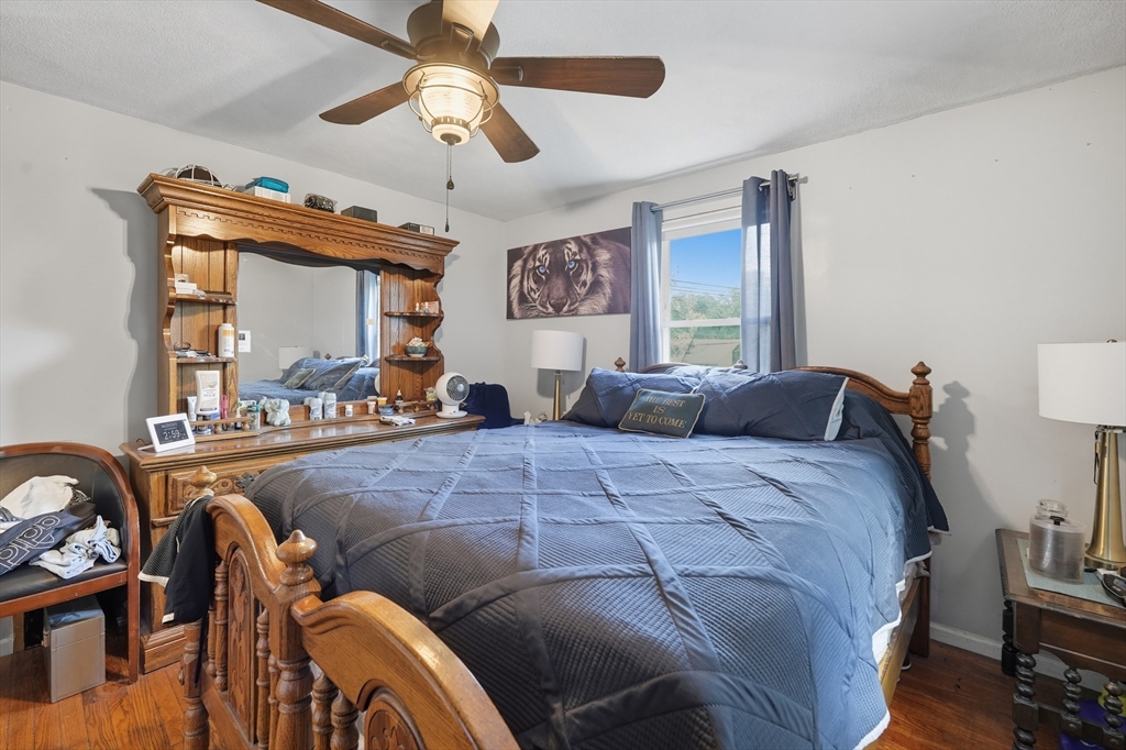 145 Amostown Road West Springfield, MA 01089 - Photo 15 of 26 a bed room with a bed and a mirror