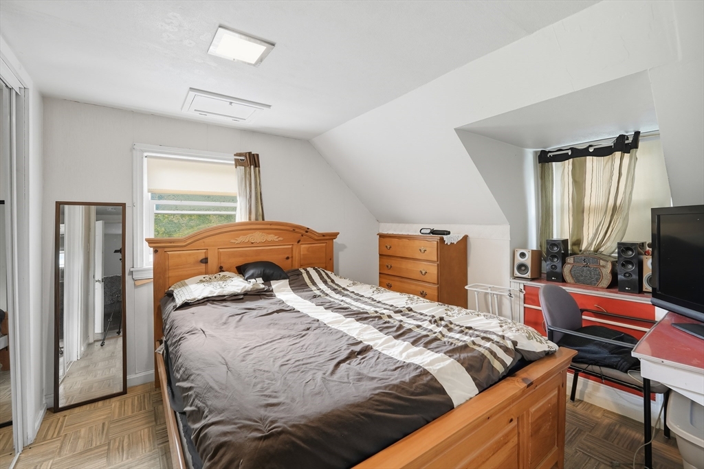 145 Amostown Road West Springfield, MA 01089 - Photo 16 of 26 a bedroom with a bed and wooden floor