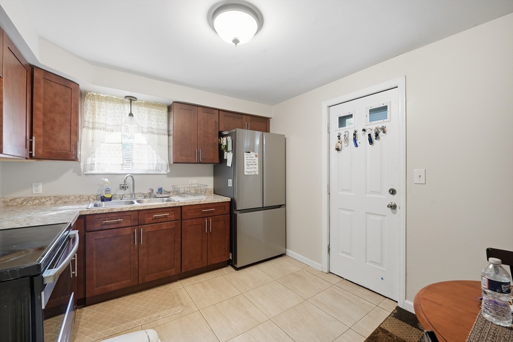145 Amostown Road West Springfield, MA 01089 - Photo 6 of 26 a kitchen with stainless steel appliances granite countertop a refrigerator and a sink