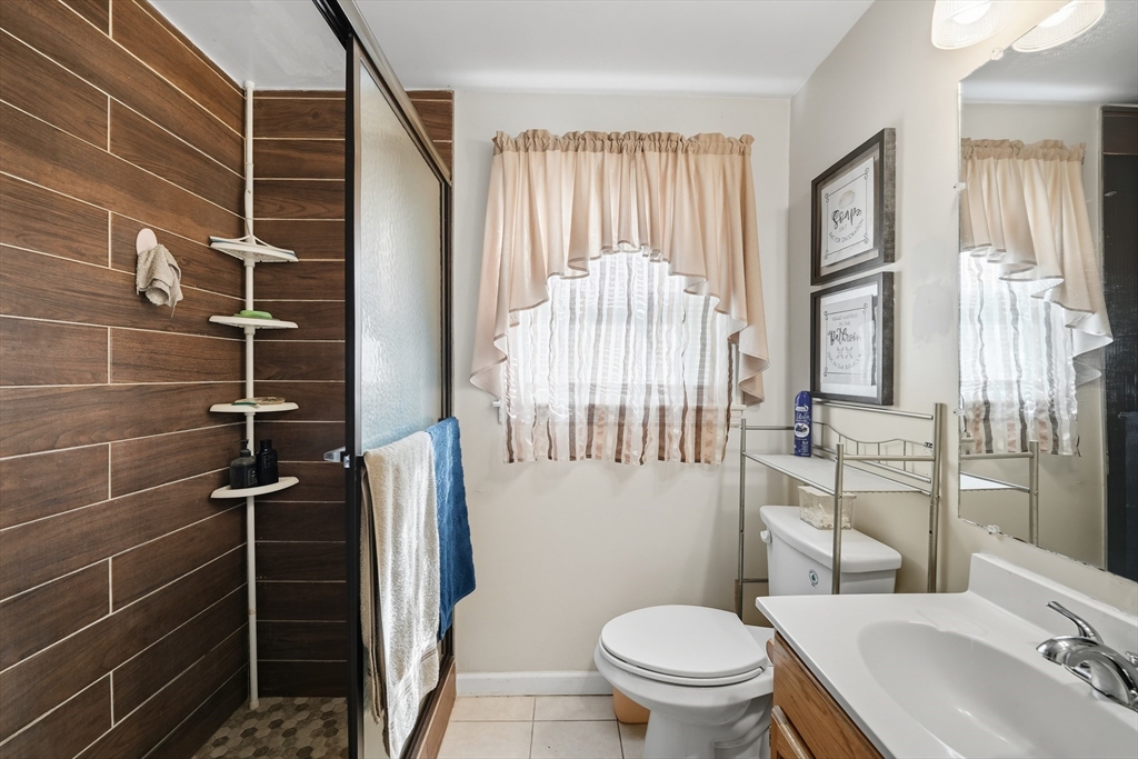 145 Amostown Road West Springfield, MA 01089 - Photo 7 of 26 a bathroom with a sink toilet and shower