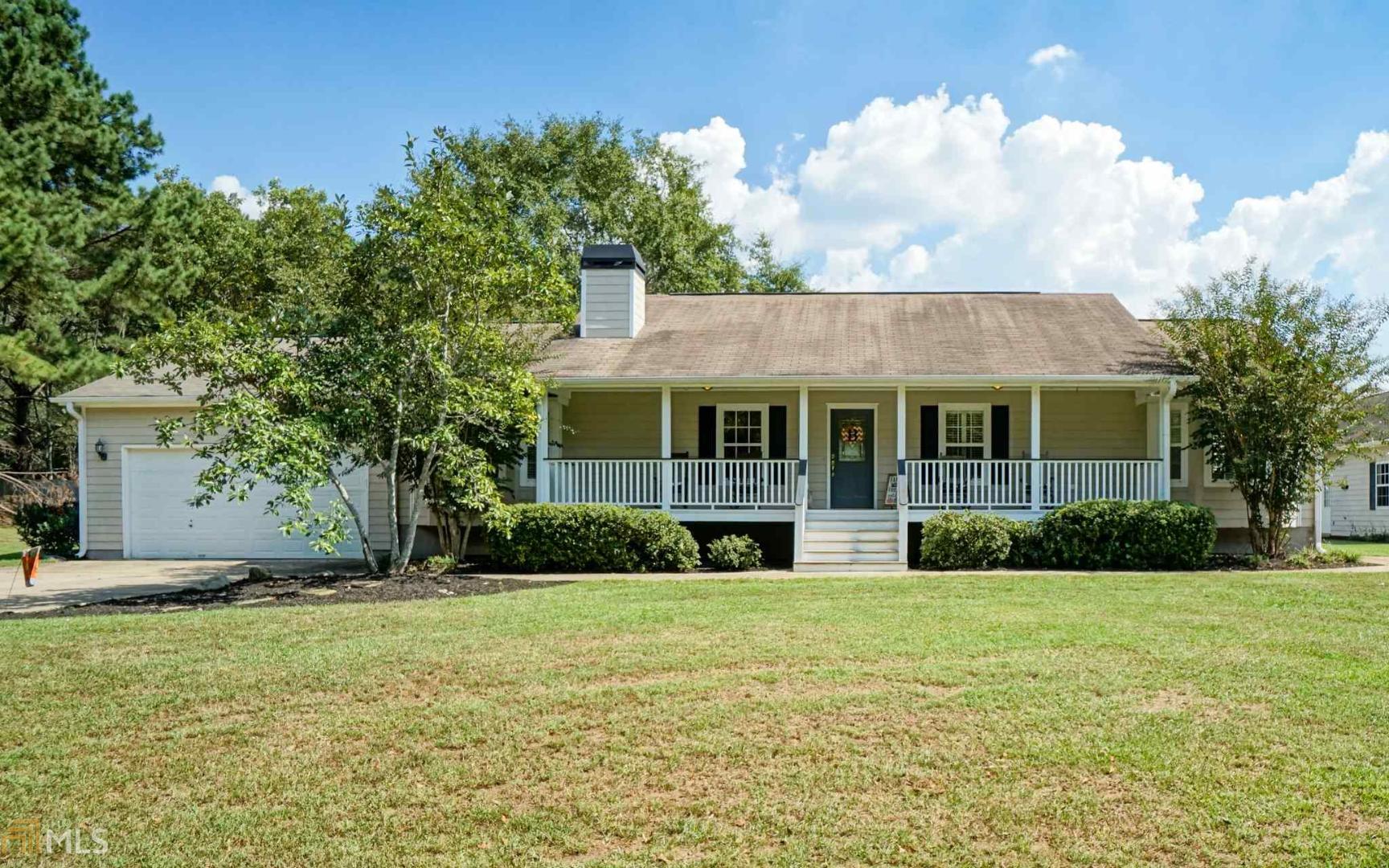 115 Long Branch Road Locust Grove, GA 30248 - Photo 1 of 1 a front view of a house with a yard