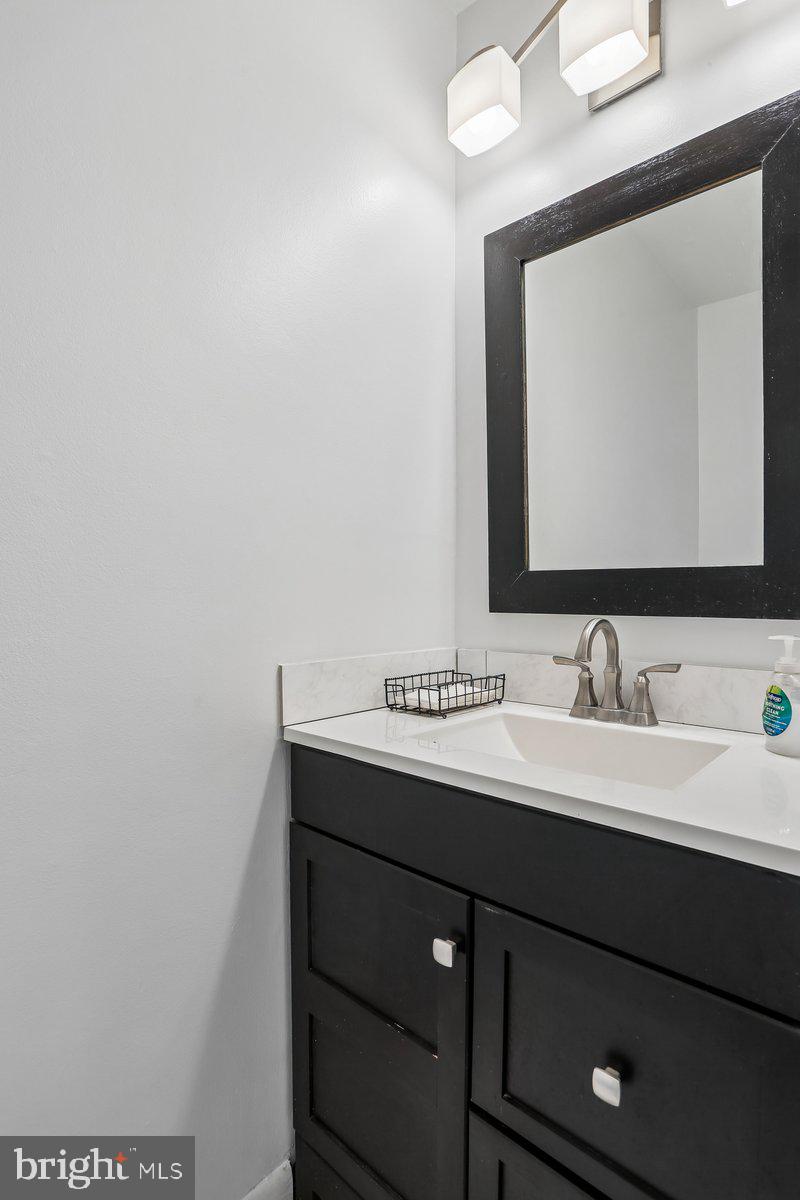 76 Timber Rock Road Gaithersburg, MD 20878 - Photo 20 of 51 a bathroom with a sink and a mirror
