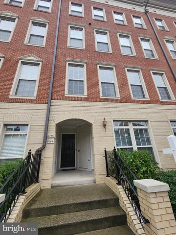 a view of a house with a small yard