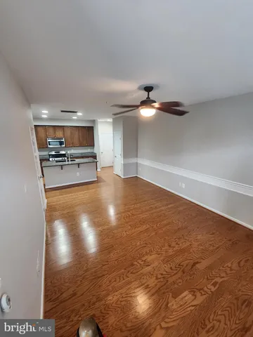 a view of water heater room with wooden floor