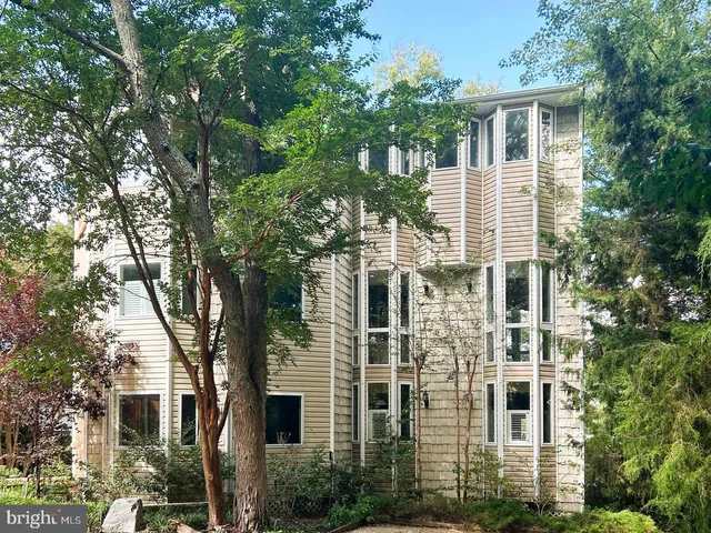 front view of a house with a tree