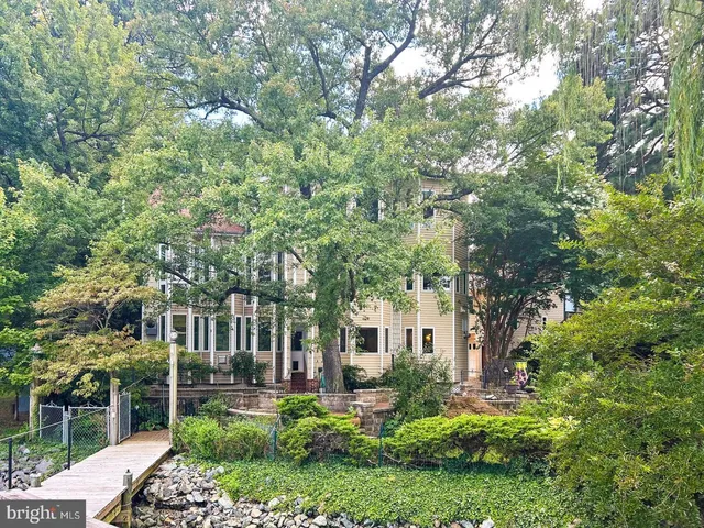 aerial view of a house with a yard