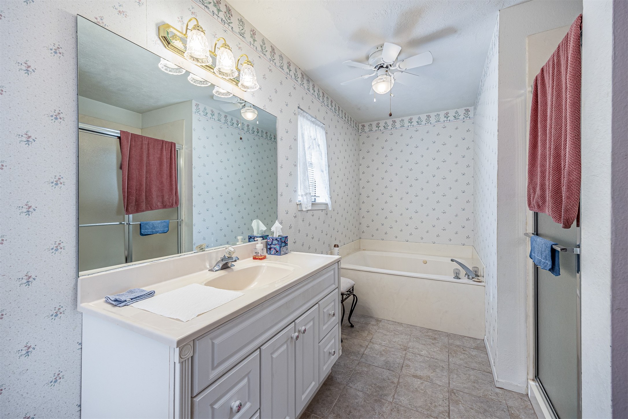329 Burwell Road Highlands, TX 77562 - Photo 26 of 44 a bathroom with a sink a toilet a mirror and shower