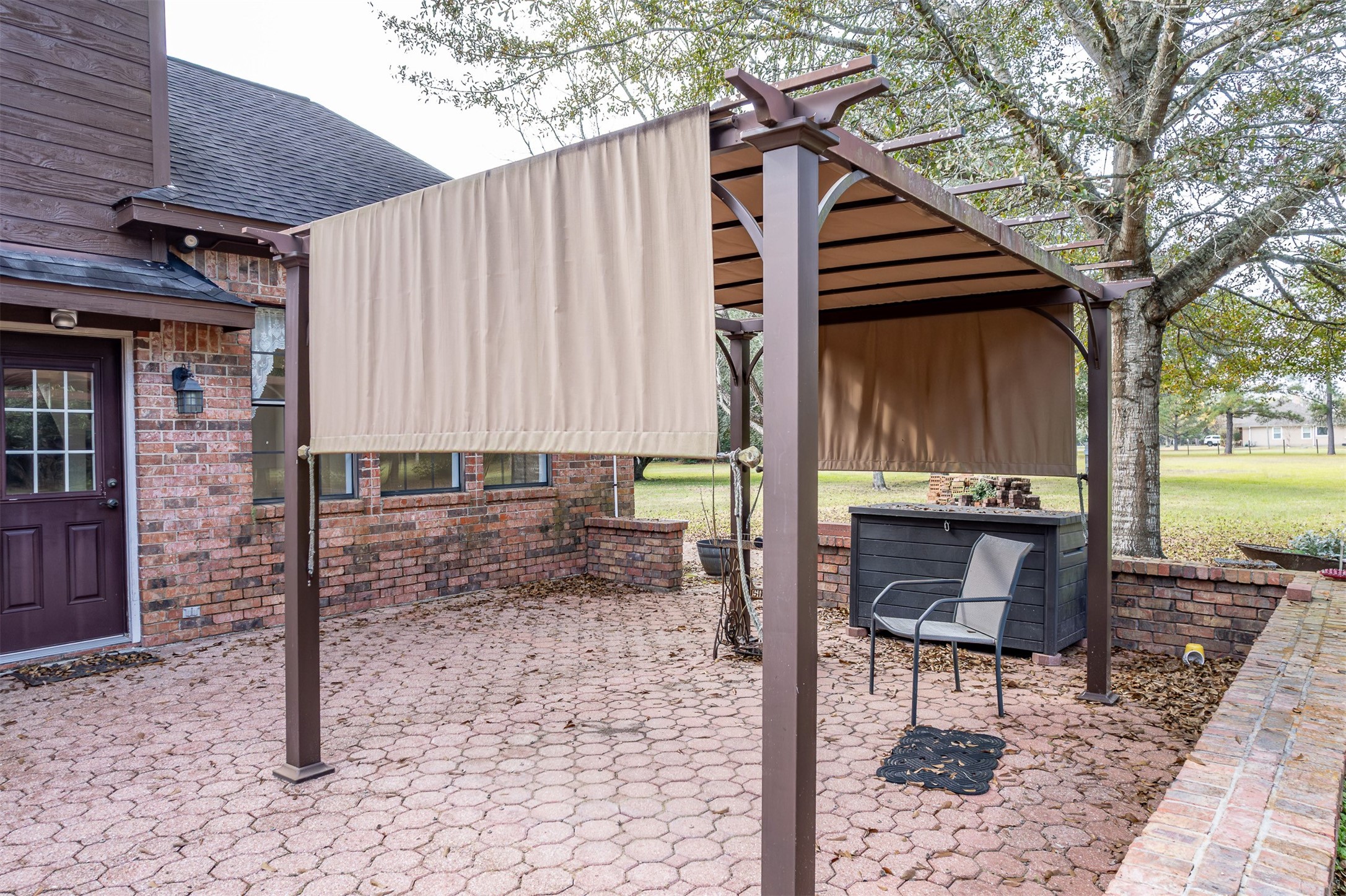 329 Burwell Road Highlands, TX 77562 - Photo 33 of 44 a backyard of a house with table and chairs