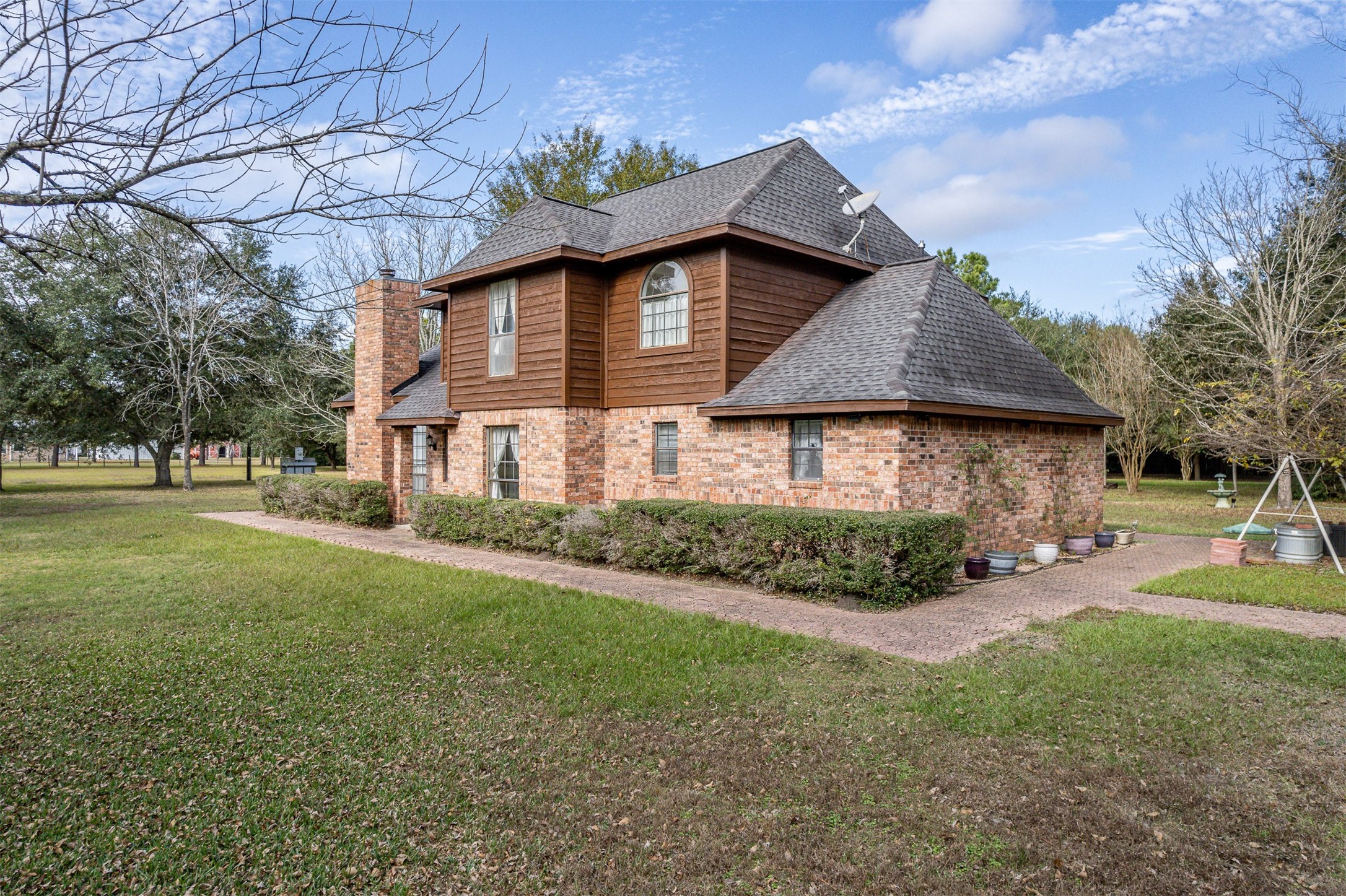 329 Burwell Road Highlands, TX 77562 - Photo 4 of 44 a front view of a house with garden