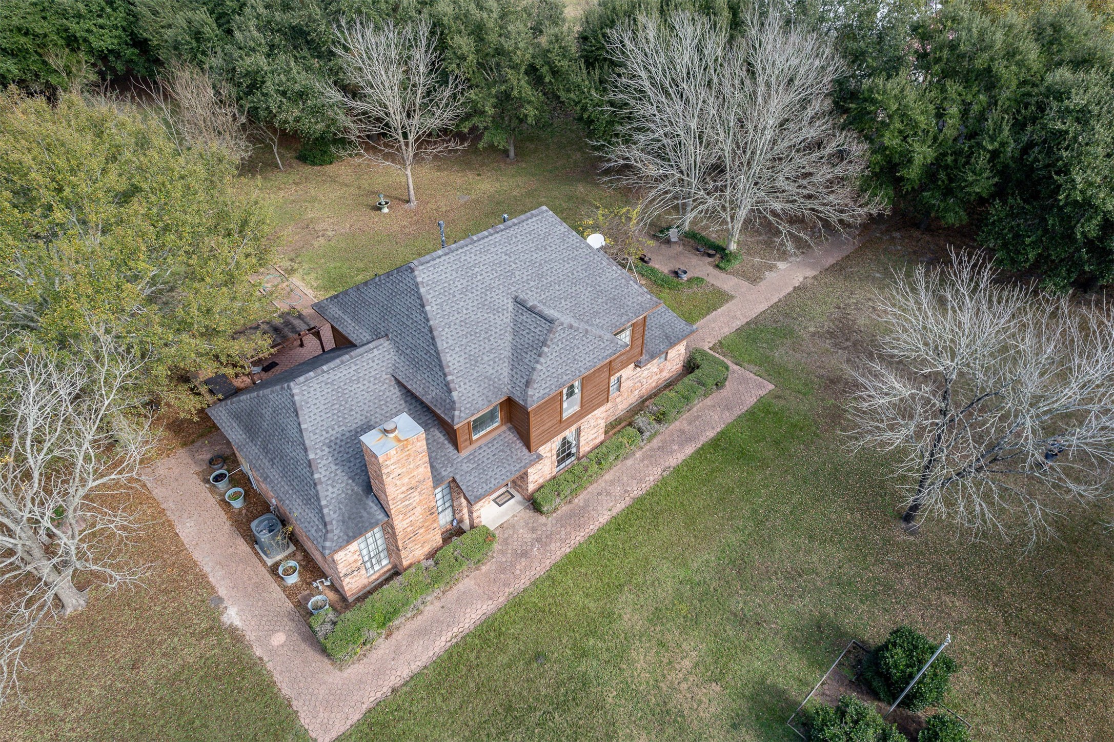 329 Burwell Road Highlands, TX 77562 - Photo 5 of 44 an aerial view of a house with outdoor space