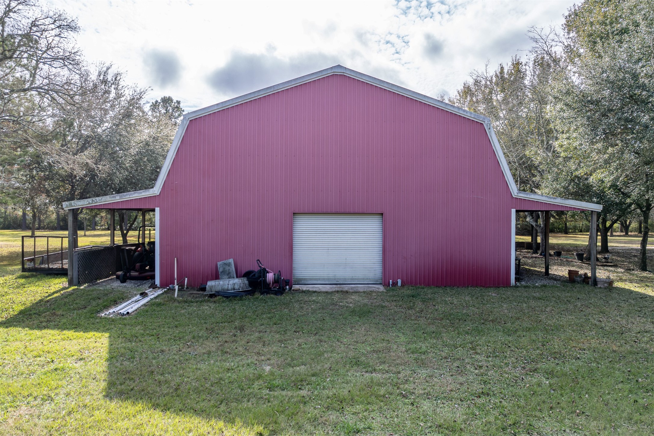 329 Burwell Road Highlands, TX 77562 - Photo 6 of 44 a backyard of a house with table and chairs