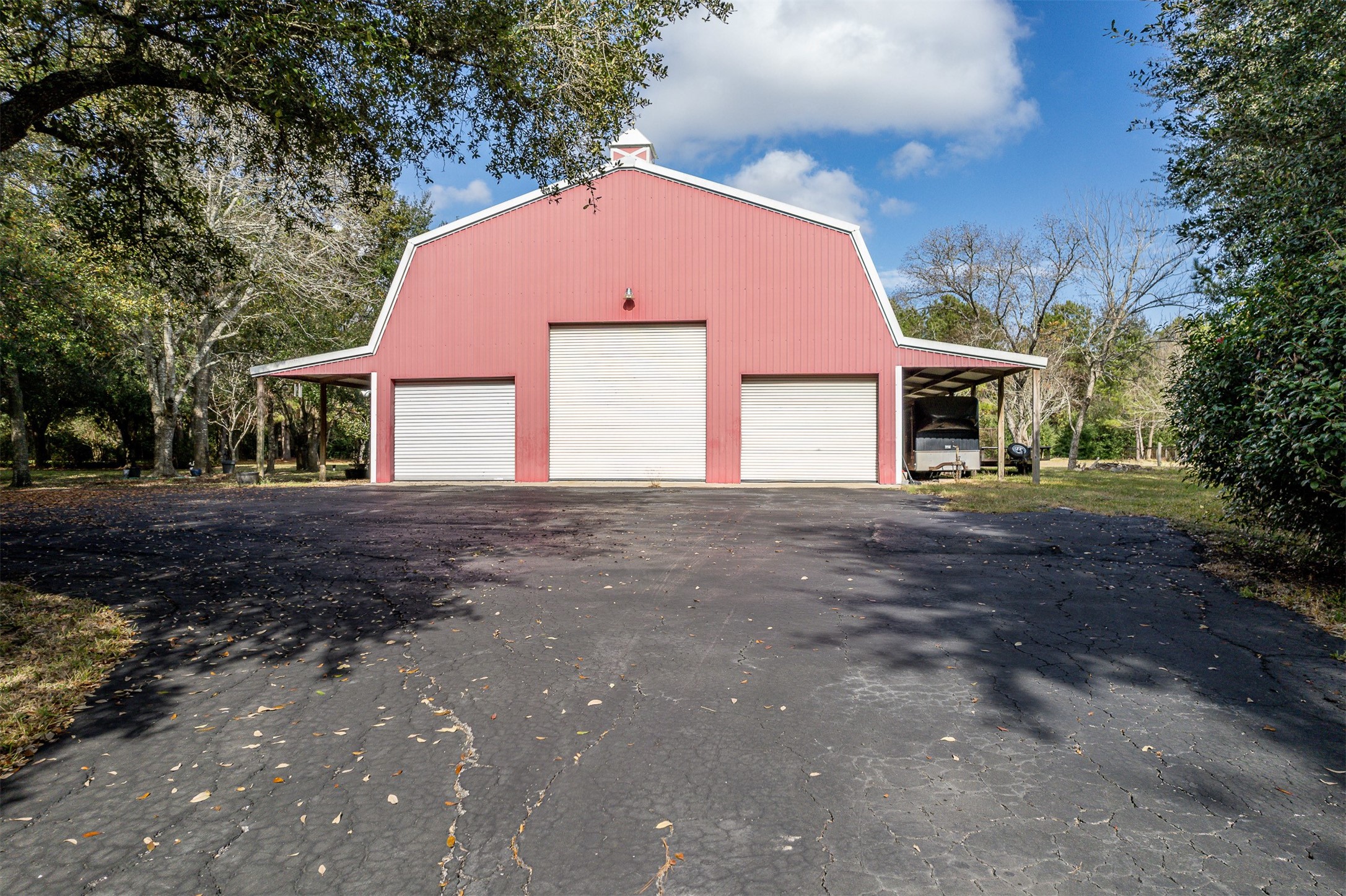 329 Burwell Road Highlands, TX 77562 - Photo 9 of 44 a front view of a house with a yard and garage