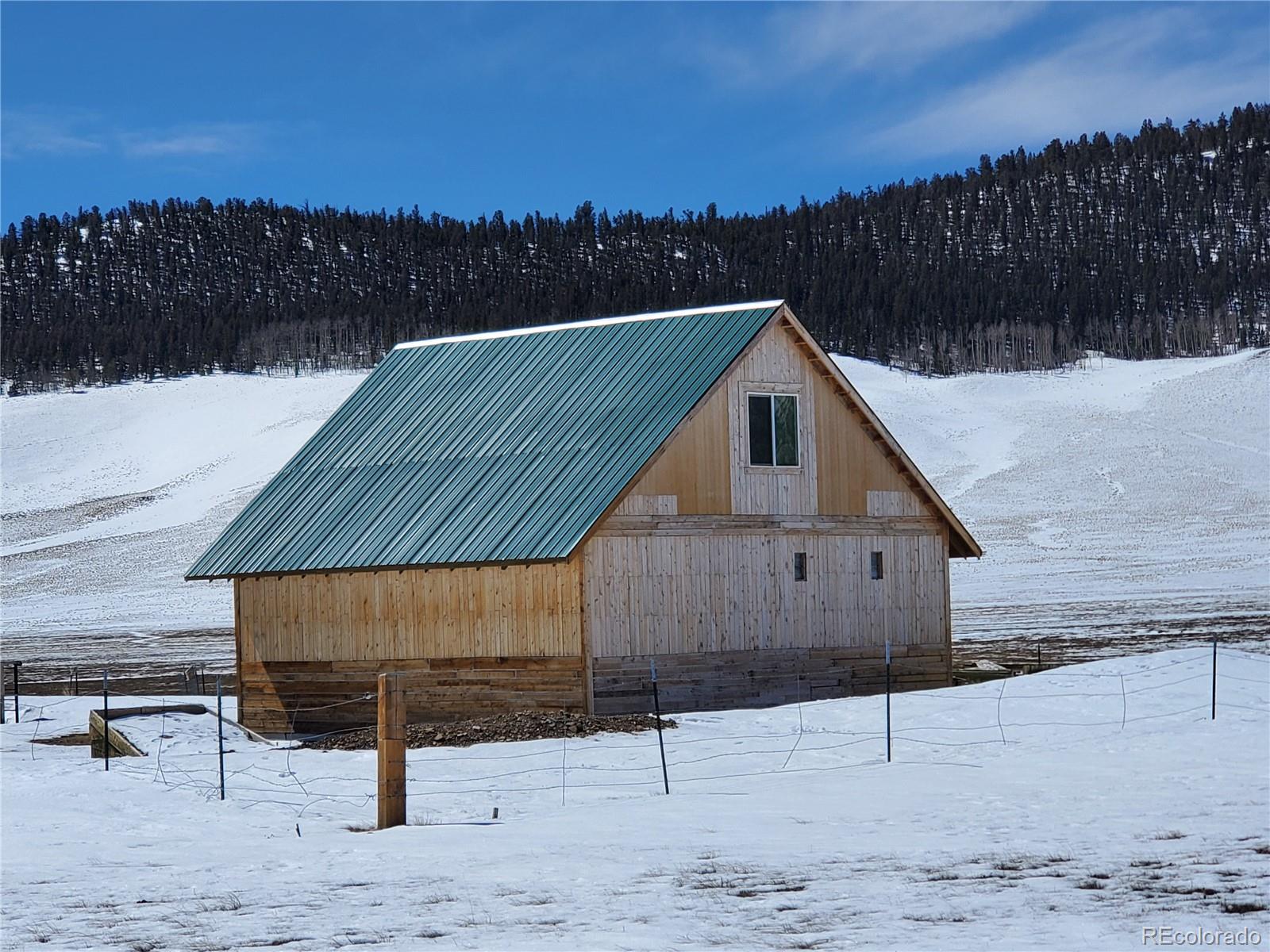 1417 Bar D Road Fairplay, CO 80440 - Photo 17 of 26 a view of a house with wooden fence
