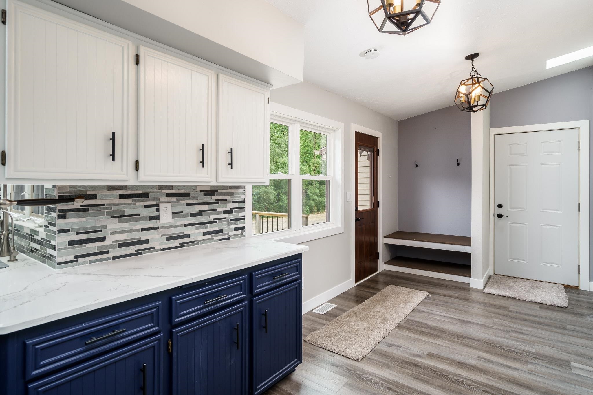 6780 Manchester Road South Beloit, IL 61080 - Photo 15 of 44 a view of a kitchen with a sink and wooden floor