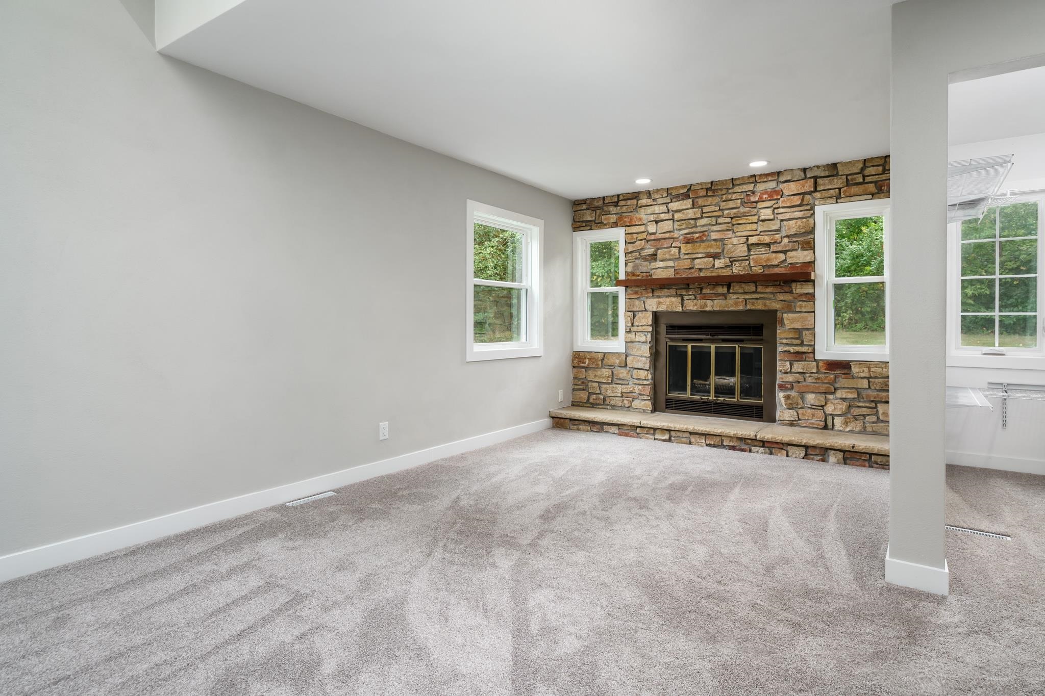6780 Manchester Road South Beloit, IL 61080 - Photo 16 of 44 an empty room with windows and fireplace