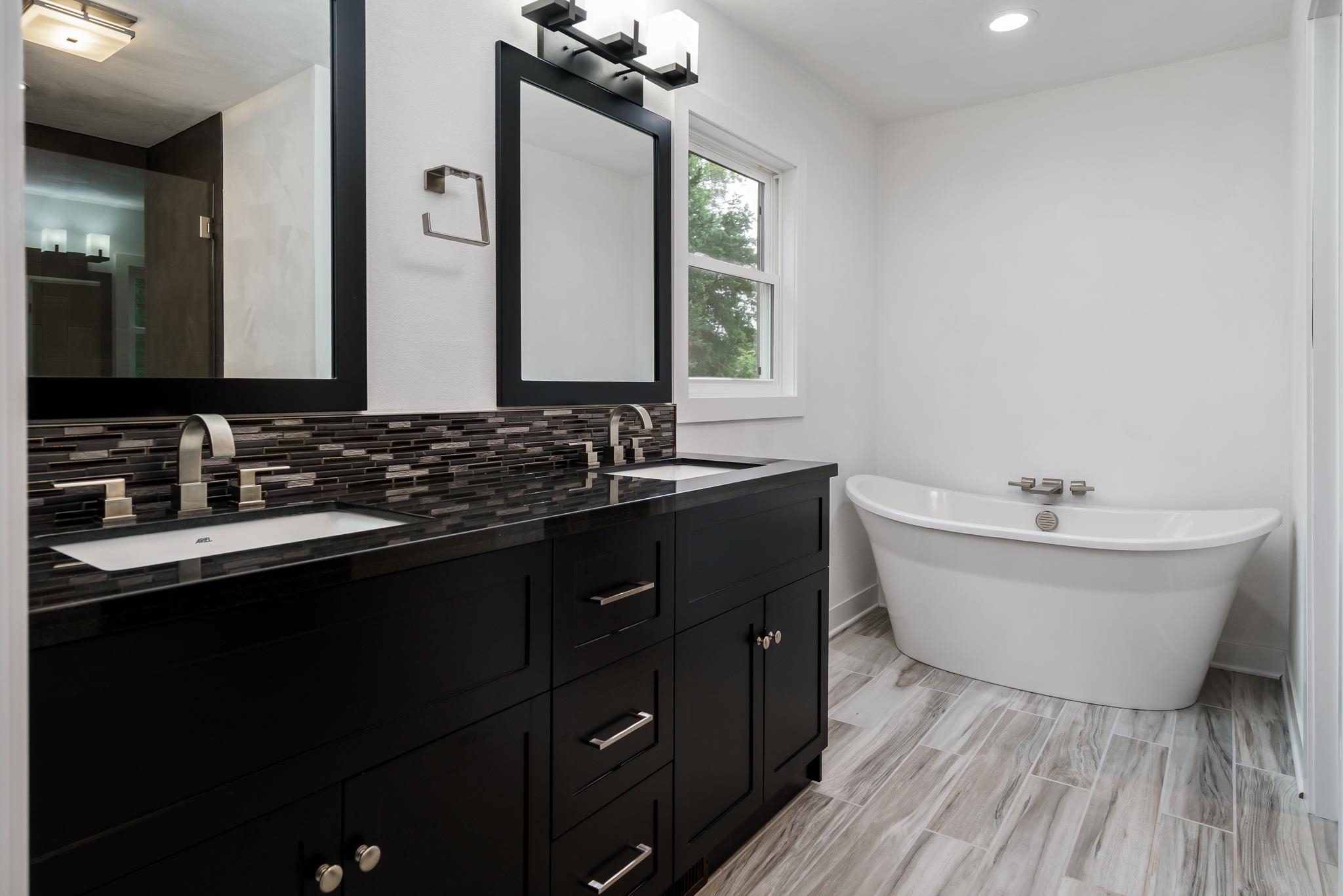 6780 Manchester Road South Beloit, IL 61080 - Photo 20 of 44 a bathroom with a double vanity sink and a mirror