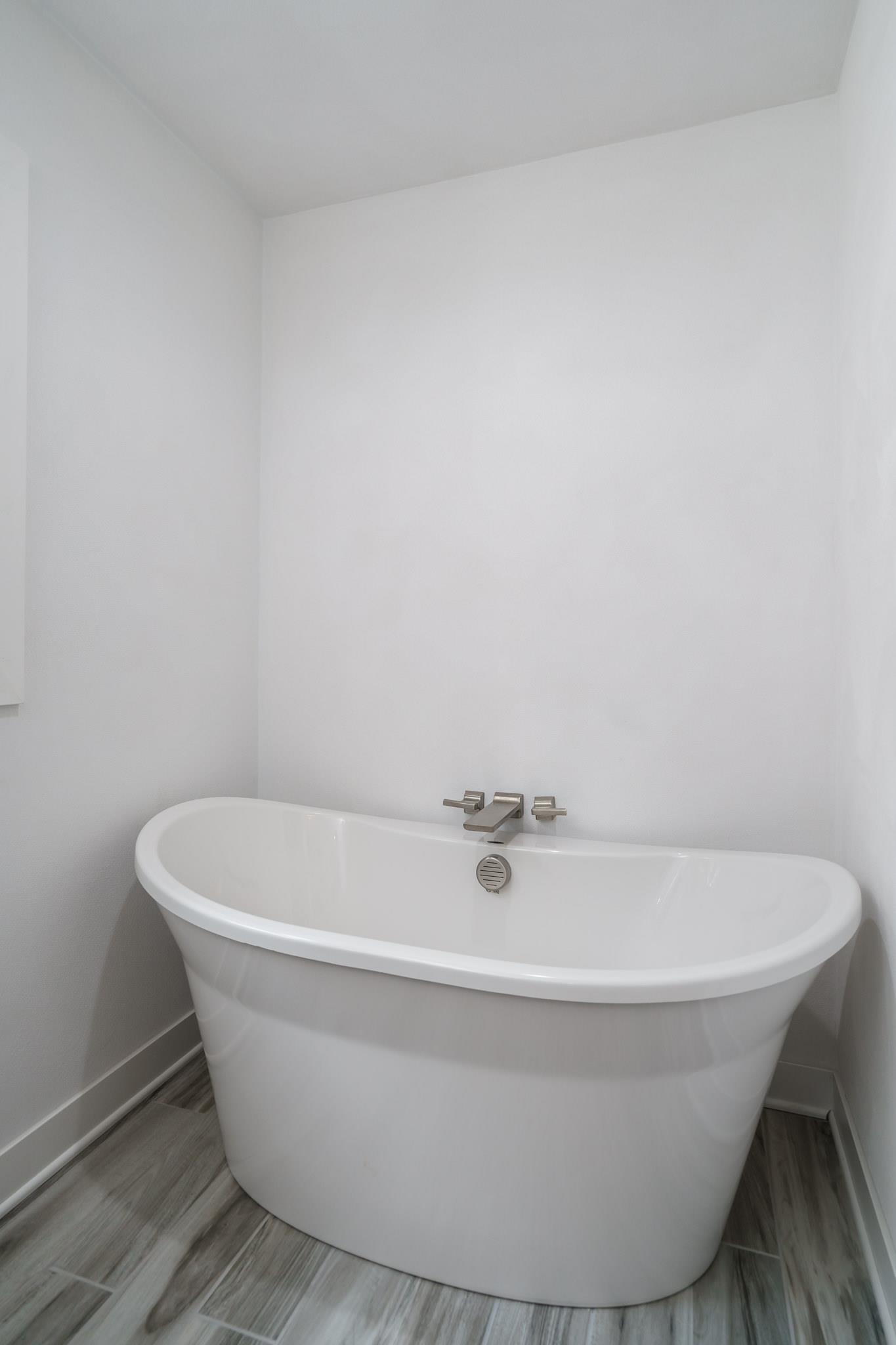 6780 Manchester Road South Beloit, IL 61080 - Photo 22 of 44 a white tub sitting in a bathroom