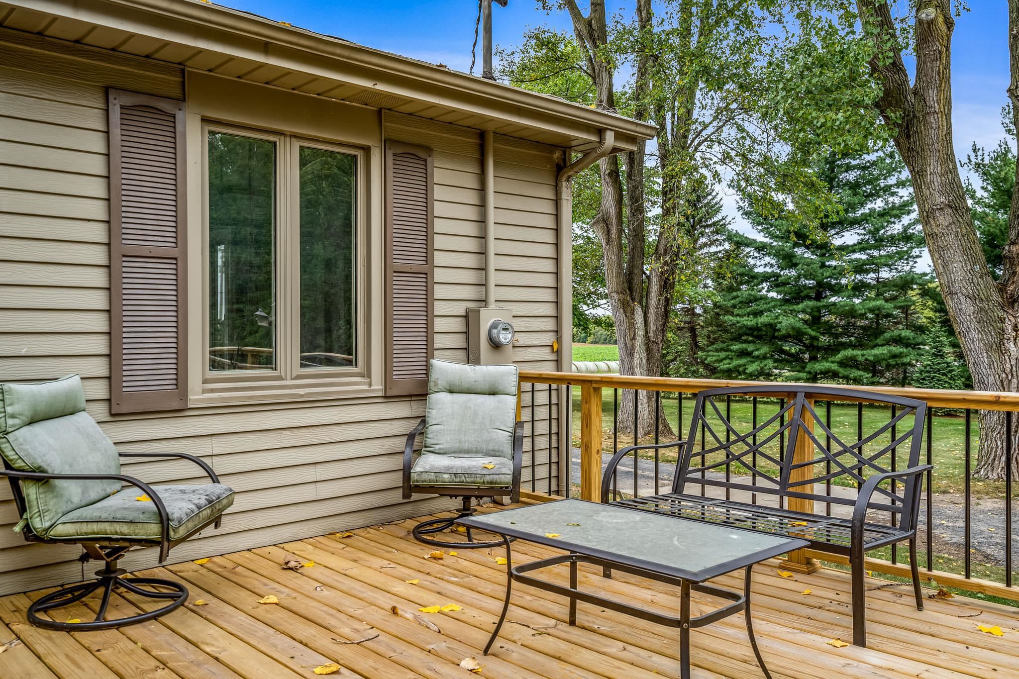 6780 Manchester Road South Beloit, IL 61080 - Photo 37 of 44 a view of a deck with wooden floor and outdoor seating