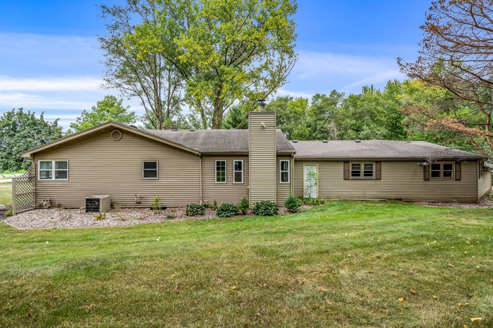 6780 Manchester Road South Beloit, IL 61080 - Photo 39 of 44 a front view of house with yard and trees