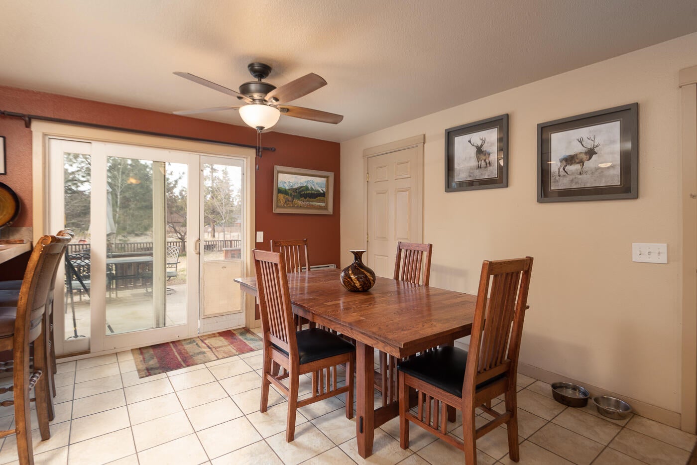 Dining area with slider to backyard.
