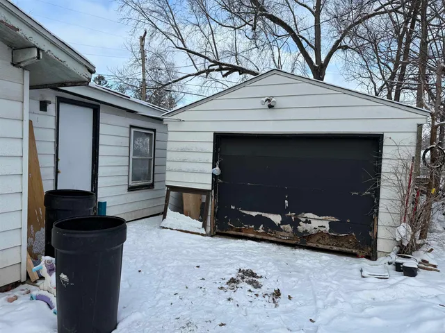 a front view of a house with parking space