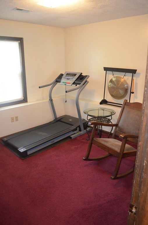 30 Raleigh Road Weymouth, MA 02189 - Photo 21 of 27 a room with gym equipment on wooden floor
