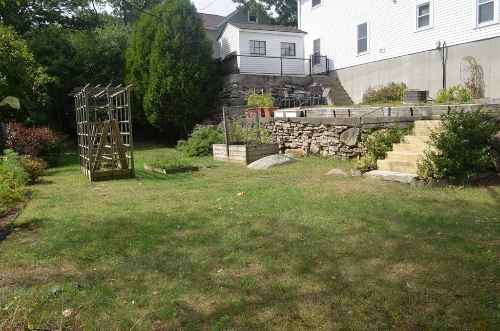 30 Raleigh Road Weymouth, MA 02189 - Photo 24 of 27 a view of a yard with table and chairs