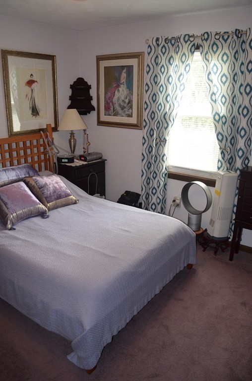 30 Raleigh Road Weymouth, MA 02189 - Photo 8 of 27 a bedroom with a bed and a painting on the wall