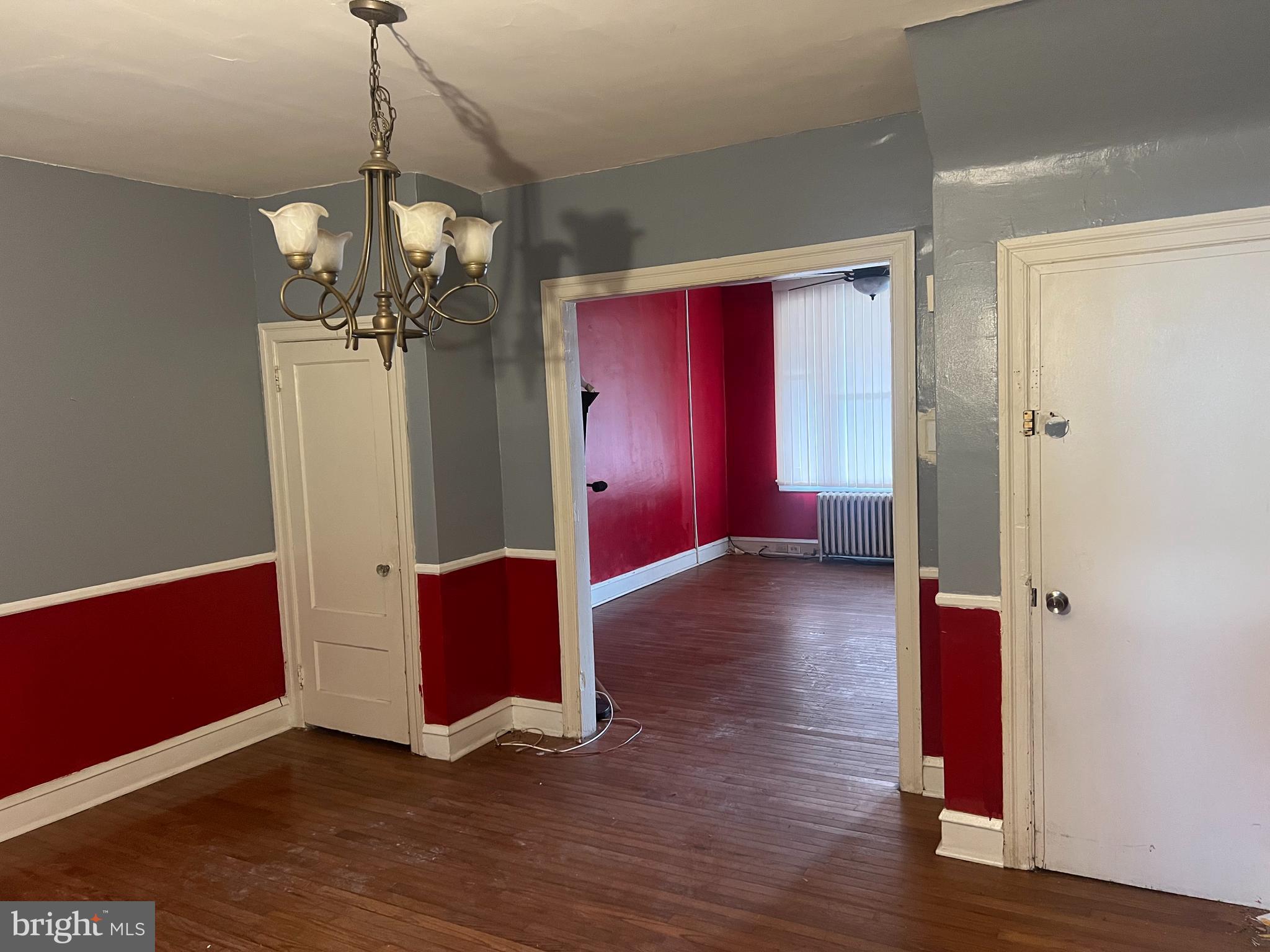 6925 Forrest Avenue Philadelphia, PA 19138 - Photo 3 of 12 a view of a room with wooden floor windows and stairs