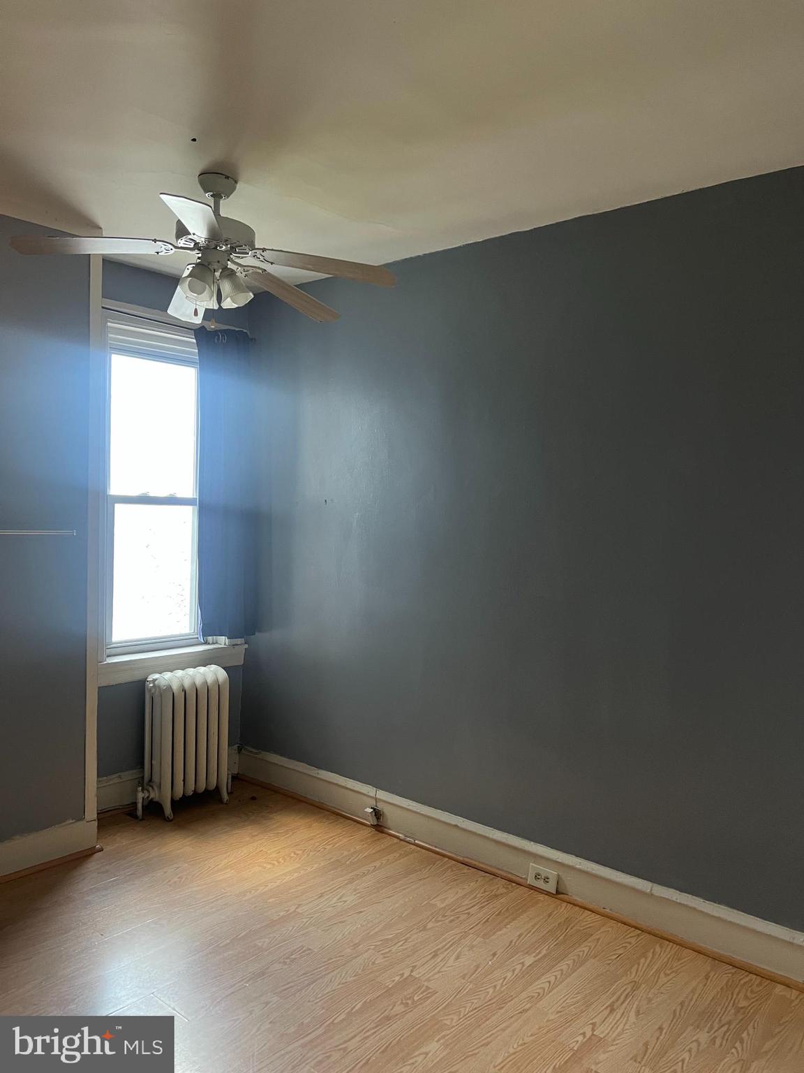 6925 Forrest Avenue Philadelphia, PA 19138 - Photo 5 of 12 an empty room with windows and fan